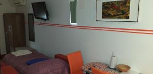 En eller flere senger på et rom på Ignacio Garzón Departamento