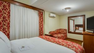 Ліжко або ліжка в номері Kuster Hotel