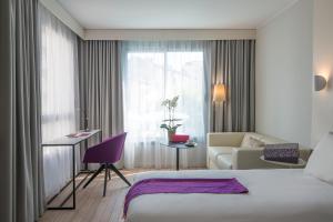 Postel nebo postele na pokoji v ubytování Mercure Ajaccio
