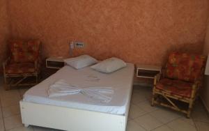 Cama ou camas em um quarto em Hotel Areia Dourada