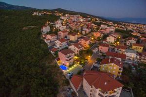 an aerial view of a town at night at Villa M in Crikvenica