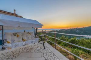living room with a couch and the sunset at Villa M in Crikvenica