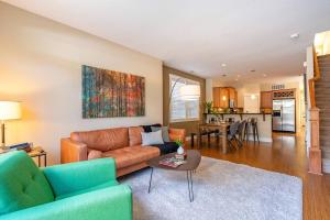 a living room with a couch and a table at Quiet, Four bedrooms, 2 King Beds in Tigard