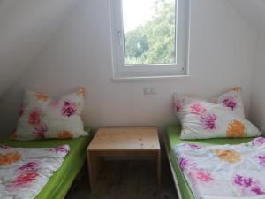 A bed or beds in a room at Ferienhaus Ulrichsbrunn