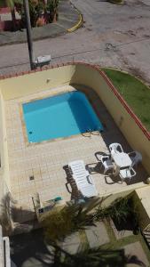 Vaizdas į baseiną apgyvendinimo įstaigoje Condominio Garça Branca arba netoliese