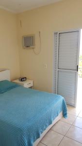 Postel nebo postele na pokoji v ubytování Condominio Garça Branca + 21 fotografií