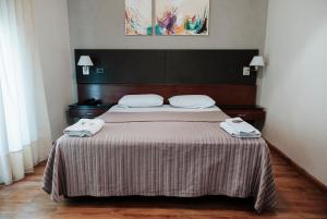 Кровать или кровати в номере Tucuman Palace Hotel