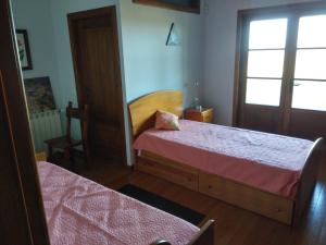 Postel nebo postele na pokoji v ubytování Quinta do Adil