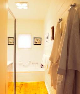 a bathroom with a bath tub and a shower at Isabella at Kyneton in Kyneton