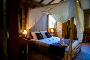 מיטה או מיטות בחדר ב-west indies cottage
