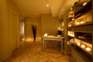 a dining room with a table with candles on it at Relais dell'Olmo in Perugia