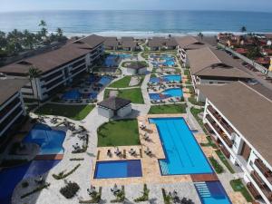 an aerial view of the resort with the ocean in the background at Cupe beach living in Porto De Galinhas