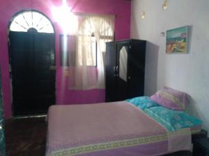 Postel nebo postele na pokoji v ubytování El Garaje Hostal
