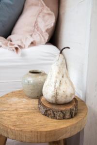 a table with a pot and a vase on it at Chum Creek Hut in Chum Creek