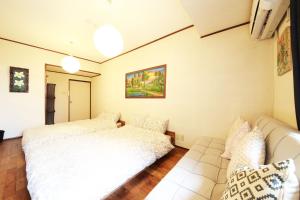 Postel nebo postele na pokoji v ubytování Nara Imai House