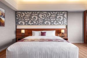 Katil atau katil-katil dalam bilik di Chuang-tang Spring Spa Hotel