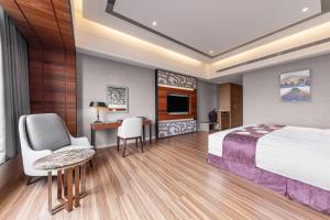 Katil atau katil-katil dalam bilik di Chuang-tang Spring Spa Hotel