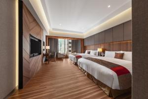 Katil atau katil-katil dalam bilik di Chuang-tang Spring Spa Hotel