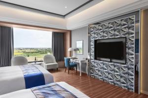 Televisyen dan/atau pusat hiburan di Chuang-tang Spring Spa Hotel
