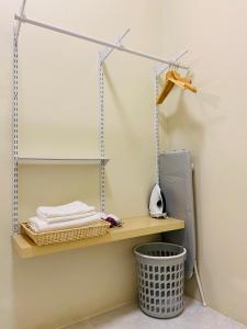 a room with a shelf and a basket at W House Ranong 2Bedroom villa in Ranong +17 photos