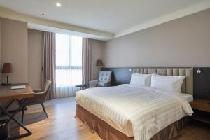 Postel nebo postele na pokoji v ubytování Lai Hotel