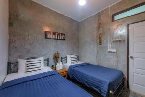 Кровать или кровати в номере Costa Bed Hua Hin