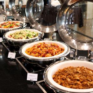 a display of different types of food on a table at Ktree Jeju Seongsan Hotel in Seogwipo +102 photos