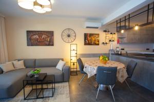 a living room with a couch and a table at Apartment Edgar in Makarska +27 photos