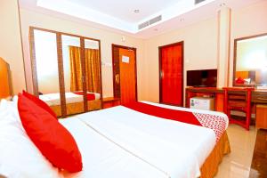 Postel nebo postele na pokoji v ubytování Sea Shell Hotel