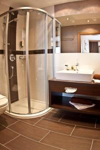 a bathroom with a shower and a sink at AlpinApart Bacher in Serfaus