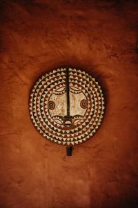 a clock on the side of a wall at Singa Lodge - Lion Roars Hotels & Lodges in Port Elizabeth