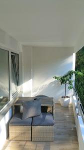 a balcony with a table and a potted plant at HOLI DAY SPA Appartement 1 in Berlin