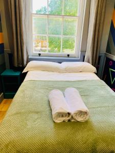 Postel nebo postele na pokoji v ubytování KX Rooms Kings Cross