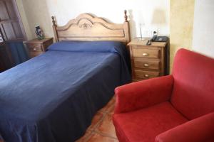 Postel nebo postele na pokoji v ubytování Hotel Don Pero + 8 fotografií