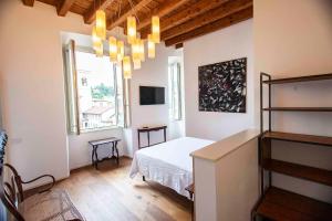Postel nebo postele na pokoji v ubytování "Camera Con Vista" Bergamo Alta