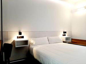 Postel nebo postele na pokoji v ubytování Hotel Melibea by gaiarooms