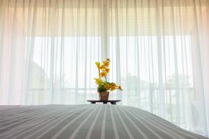 Postel nebo postele na pokoji v ubytování Nam Talay Resort