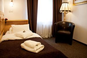 Posteľ alebo postele v izbe v ubytovaní Hotel Pod Orłem
