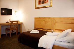 Posteľ alebo postele v izbe v ubytovaní Hotel Pod Orłem