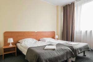 Łóżko lub łóżka w pokoju w obiekcie Gdański Dom Turystyczny Hostel