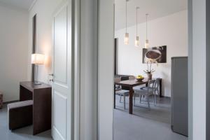 a kitchen and dining room with a dining room table at Residenza Termini in Rome