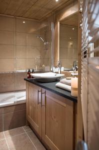 Koupelna v ubytování CGH Résidence Boutique Le Lodge des Neiges