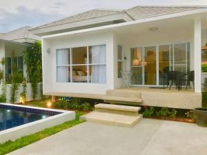 a house with a swimming pool in front of it at 2 Bedroom Luxury Pool Villa Orchid short walk to Beach SDV002-By Samui Dream Villas in Mae Nam