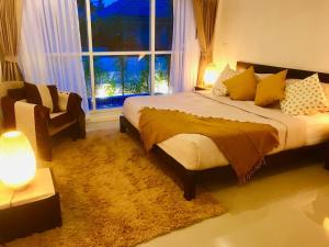 a bedroom with a bed and a window and a chair at 2 Bedroom Luxury Pool Villa Orchid short walk to Beach SDV002-By Samui Dream Villas in Mae Nam +21 photos