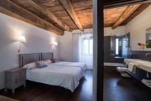 Postel nebo postele na pokoji v ubytování Casa Rural Enea