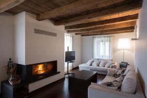 a living room with a couch and a fireplace at Casa Rural Enea in Oskotz