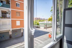 a view of a street from a window at PISO DE DISEÑO A 5 MIN ANDANDO DE LA PLAYA in Valencia