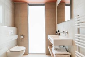 a bathroom with a sink and a toilet at Cozy Pillow in Utrecht
