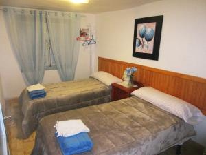 A bed or beds in a room at Casa Terzia a 10 min de Logroño
