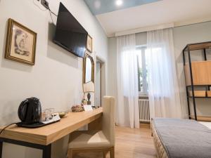 Postel nebo postele na pokoji v ubytování Brunelli B&B